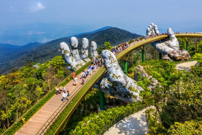 Young,Traveler,Couple,Walking,On,The,Golden,Bridge,In,Bana